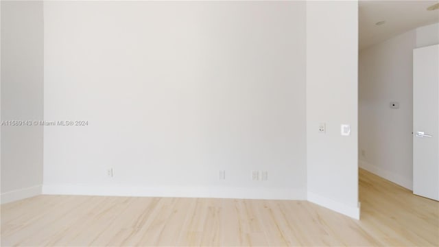 unfurnished room with light hardwood / wood-style flooring