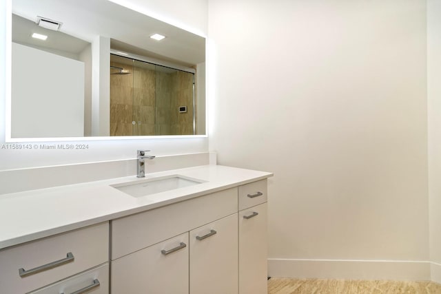 bathroom with vanity with extensive cabinet space