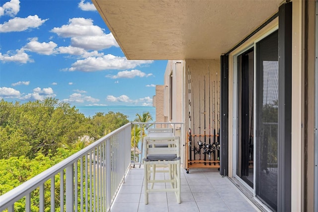 balcony featuring a water view