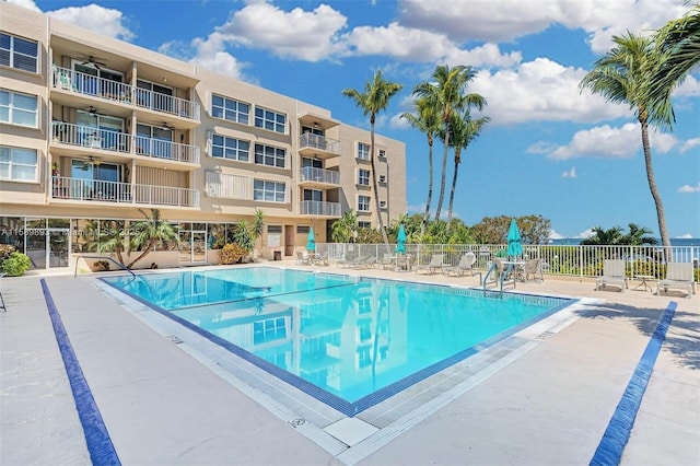 pool featuring a patio and fence