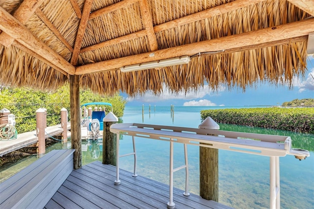 view of dock featuring a water view and a gazebo