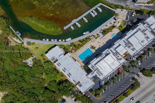 birds eye view of property with a water view