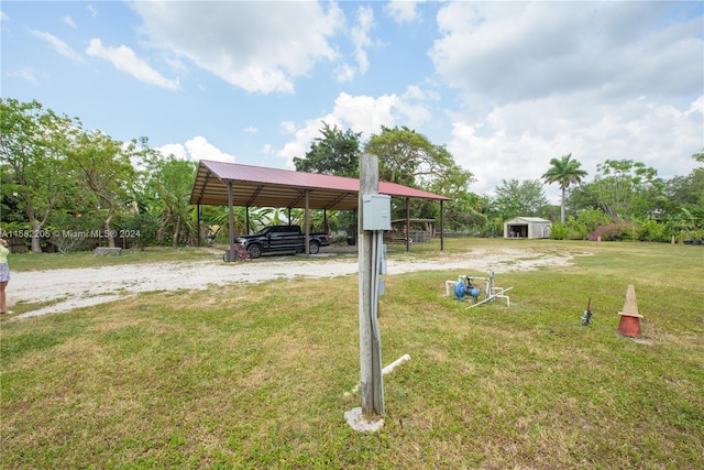 view of yard with a carport