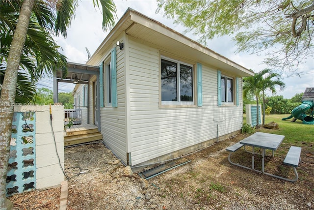 view of side of property featuring a deck