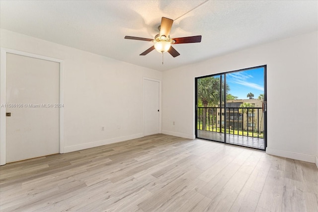 unfurnished room with ceiling fan and light hardwood / wood-style floors