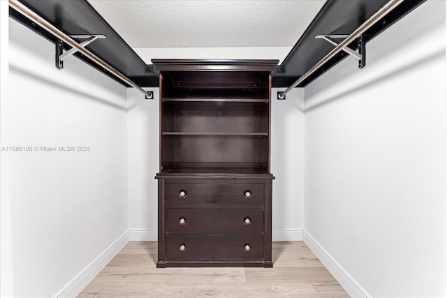 walk in closet featuring light wood-type flooring