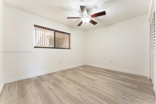 unfurnished room with ceiling fan and light hardwood / wood-style floors