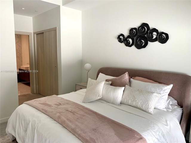 bedroom featuring tile floors and a closet