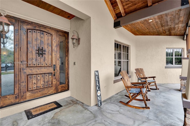 property entrance featuring covered porch