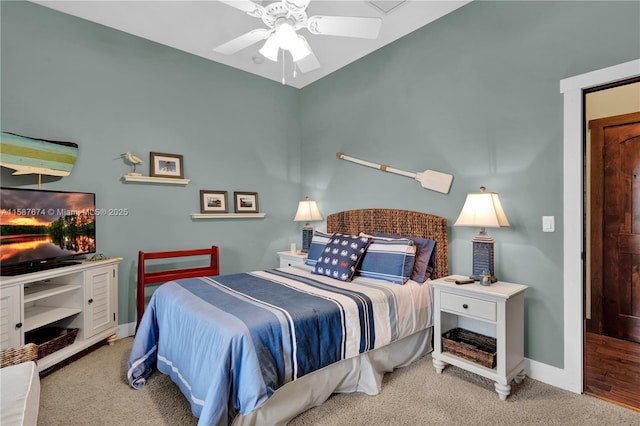 bedroom featuring ceiling fan and light colored carpet