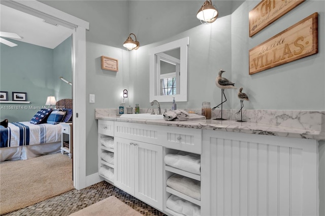 bathroom featuring tile patterned floors and vanity