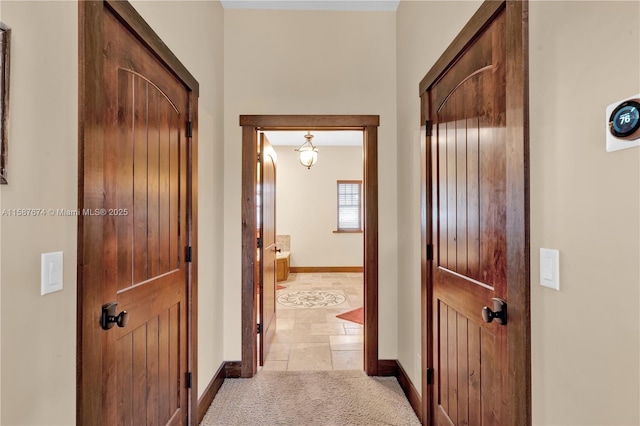 hallway with light carpet