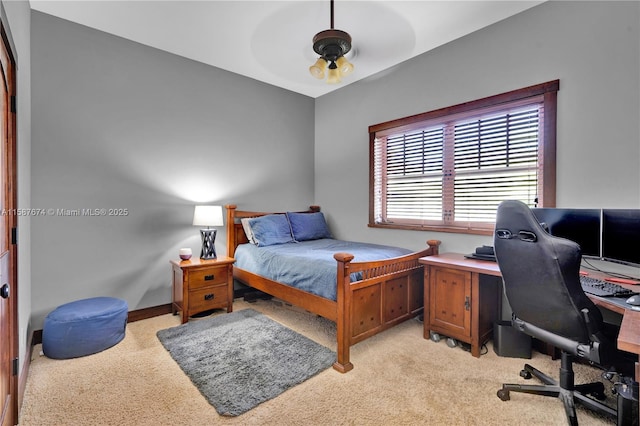 bedroom featuring light carpet and ceiling fan