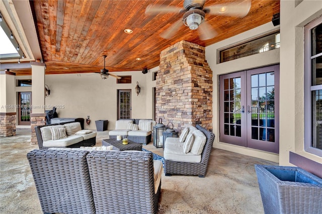 view of patio / terrace with an outdoor living space, ceiling fan, and french doors