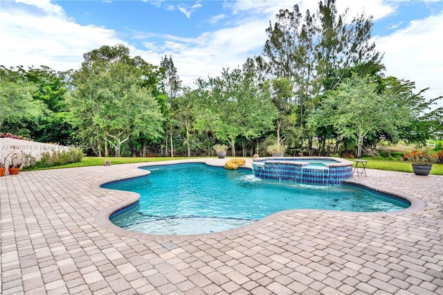 view of pool with pool water feature, an in ground hot tub, and a patio area