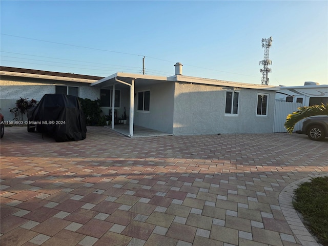 rear view of house featuring a patio area