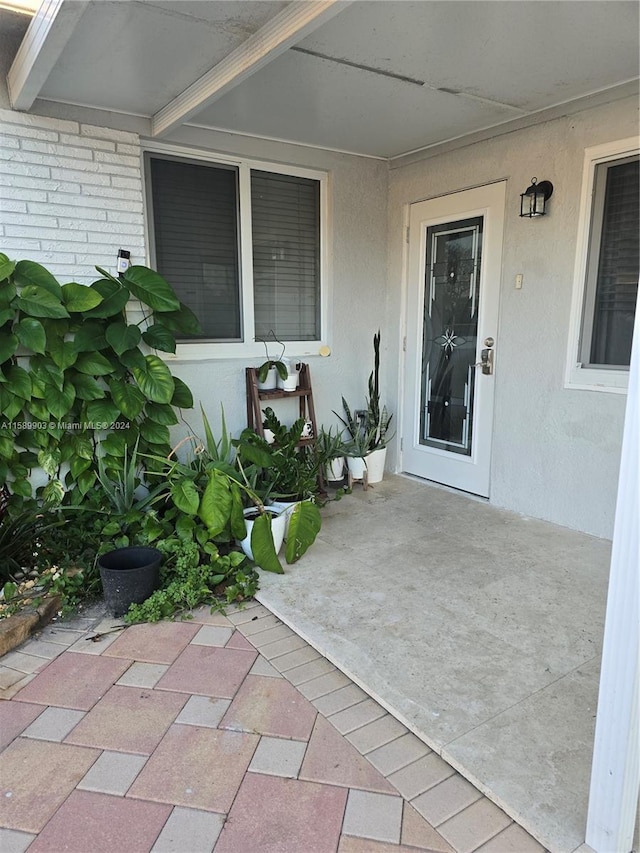 doorway to property featuring a patio