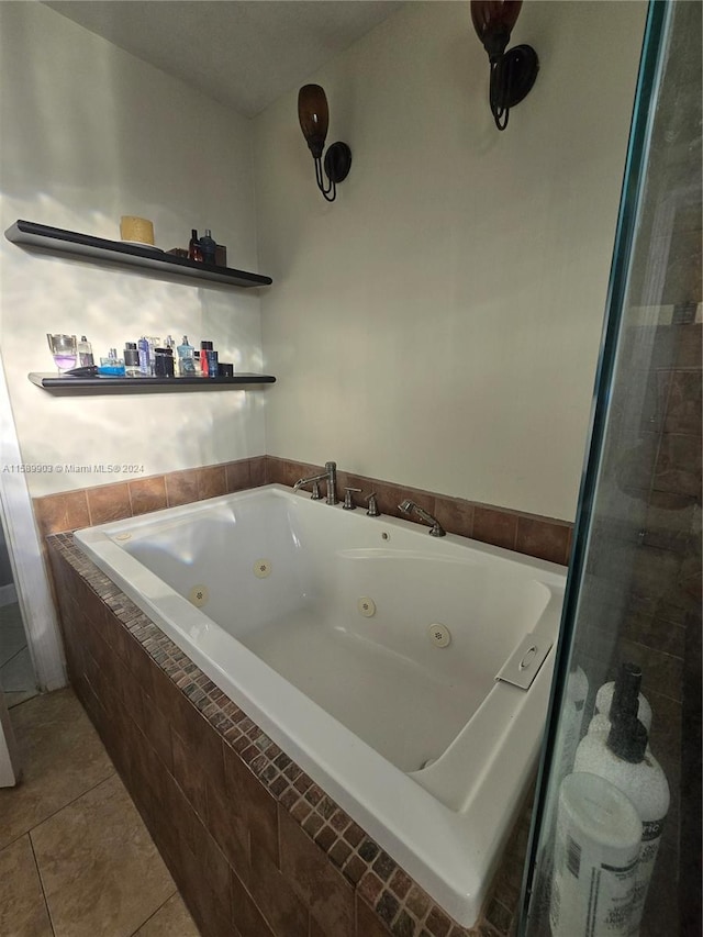 bathroom featuring tile flooring and a relaxing tiled bath