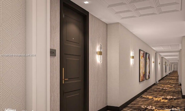 hall featuring baseboards and dark wood finished floors