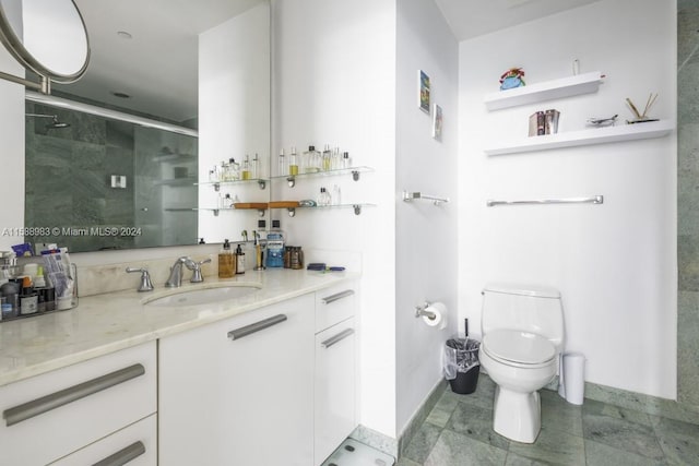 bathroom featuring a shower with door, tile flooring, vanity, and toilet