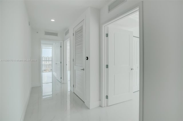 corridor with tile patterned flooring