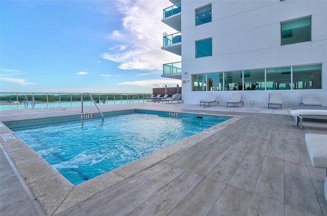 view of pool featuring a patio area