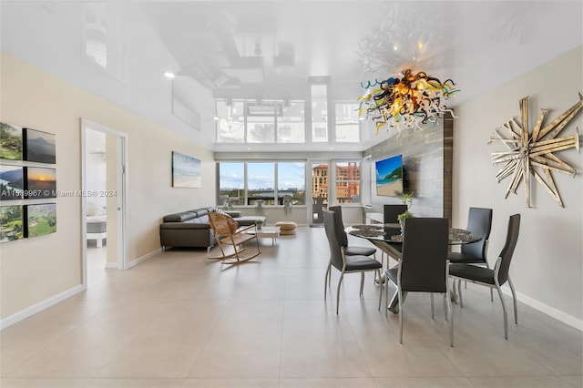 tiled dining space with a high ceiling