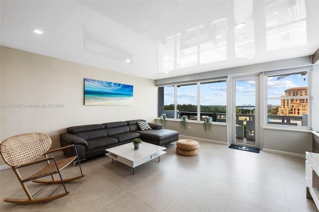 tiled living room with plenty of natural light