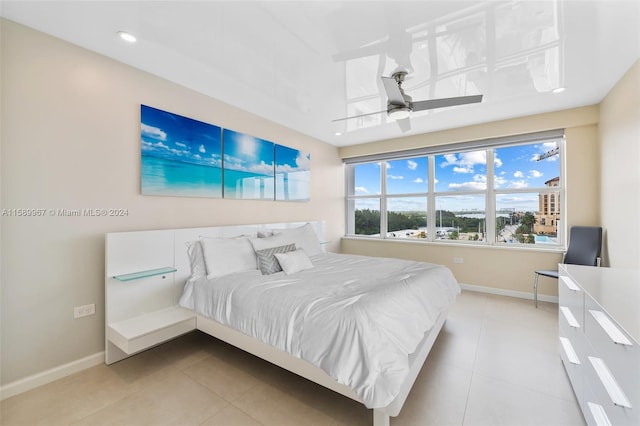 tiled bedroom with ceiling fan