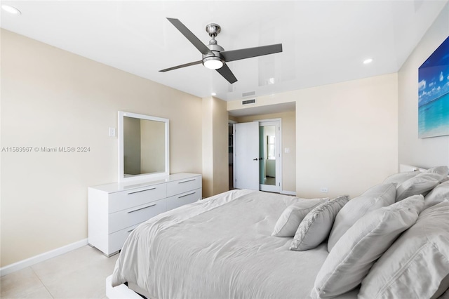 bedroom with ceiling fan and light tile floors