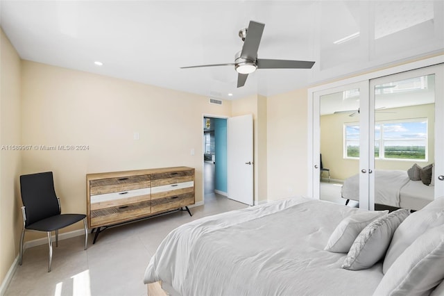 tiled bedroom with ceiling fan, french doors, and access to outside