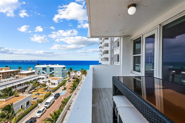 balcony featuring a water view