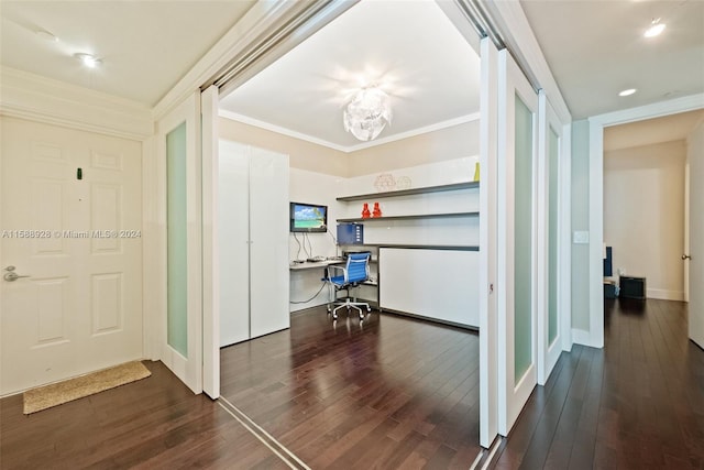 corridor featuring ornamental molding and dark hardwood / wood-style flooring