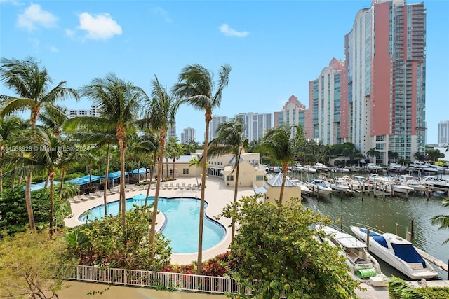 view of swimming pool featuring a water view