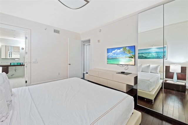 bedroom featuring dark hardwood / wood-style flooring