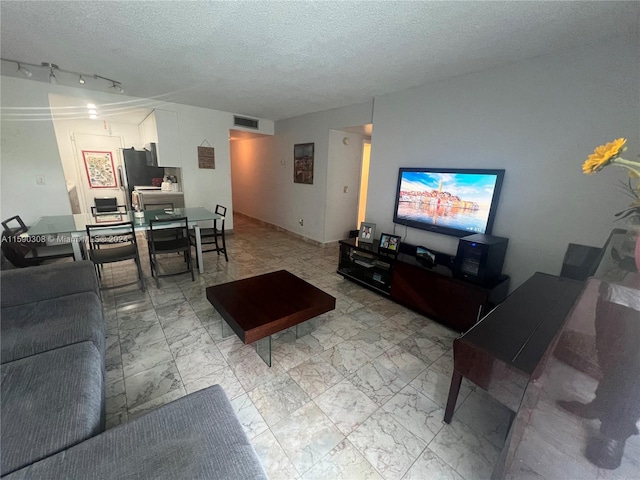 living room featuring a textured ceiling