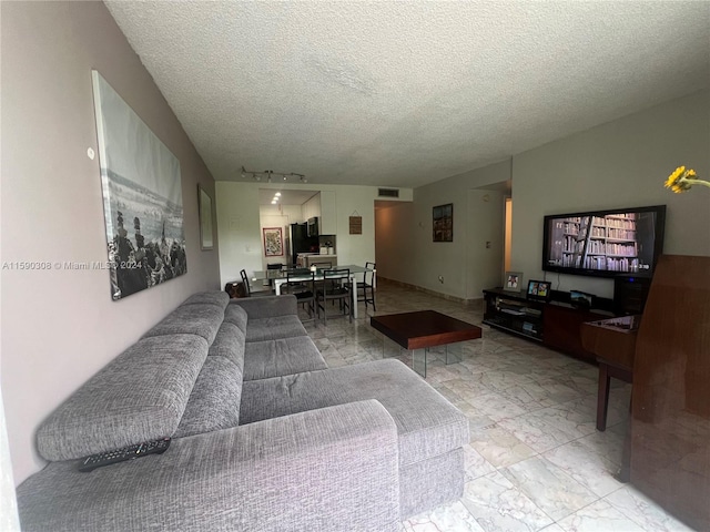 living room featuring a textured ceiling