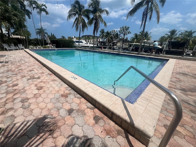 view of swimming pool with a patio