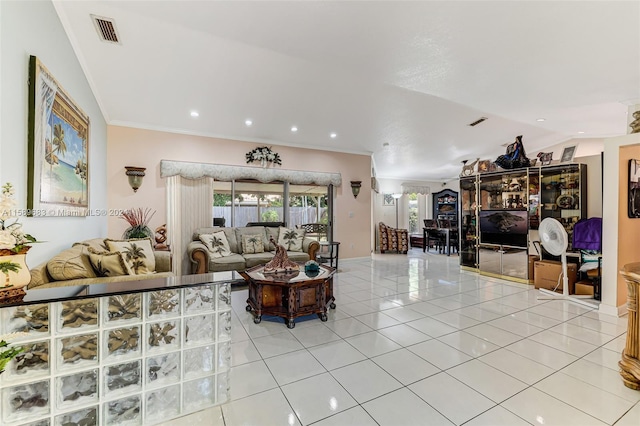 living room with vaulted ceiling, crown molding, and light tile flooring