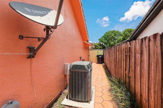 view of side of property with central AC