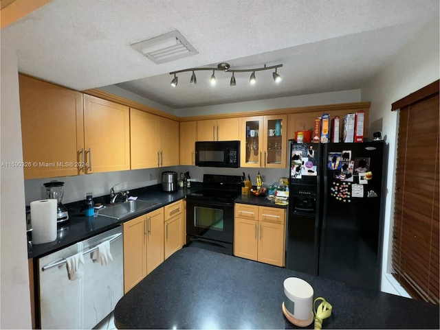 kitchen featuring sink, a textured ceiling, black appliances, and rail lighting