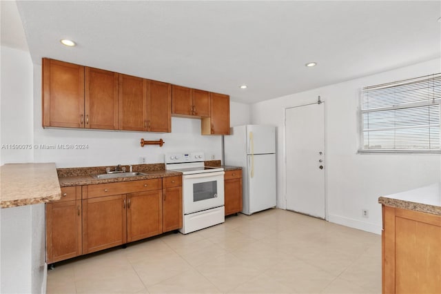 kitchen featuring white appliances and sink