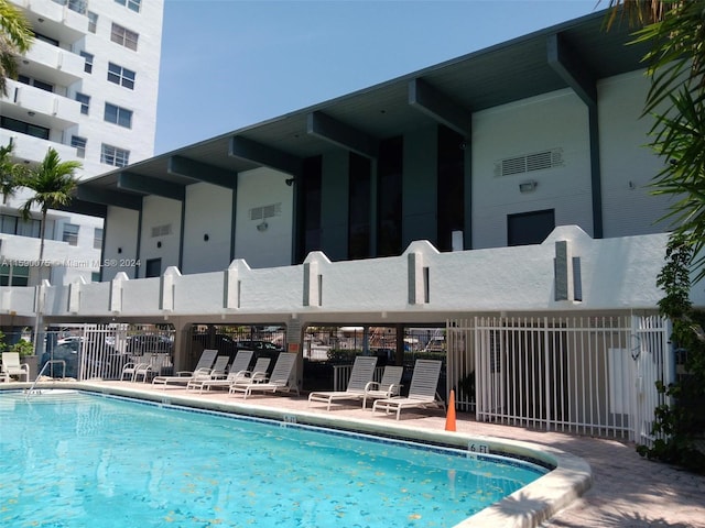 view of swimming pool with a patio