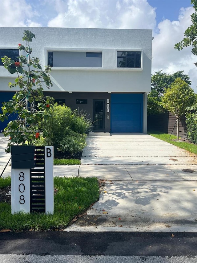 808 SW 9th St Unit 808-B, Fort Lauderdale, FL 33315 - view of front of home featuring stucco siding and concrete driveway