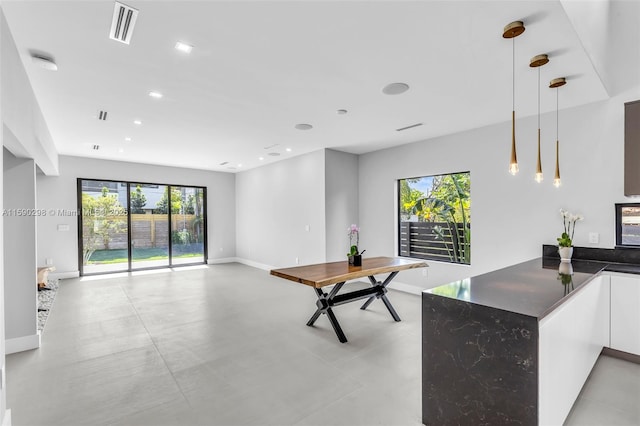 808 SW 9th St Unit 808-B, Fort Lauderdale, FL 33315 - kitchen with modern cabinets, healthy amount of natural light, finished concrete flooring, pendant lighting, and recessed lighting