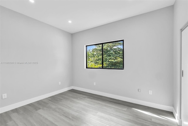 spare room with light wood-type flooring