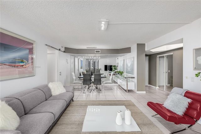 tiled living room featuring a textured ceiling