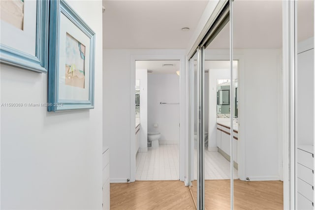 corridor featuring light hardwood / wood-style floors