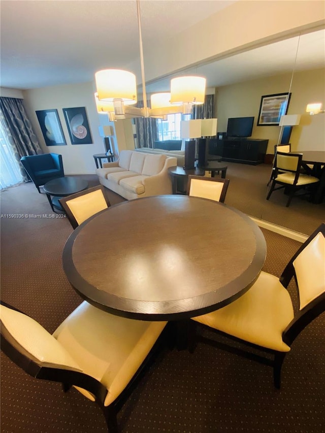 view of carpeted dining area