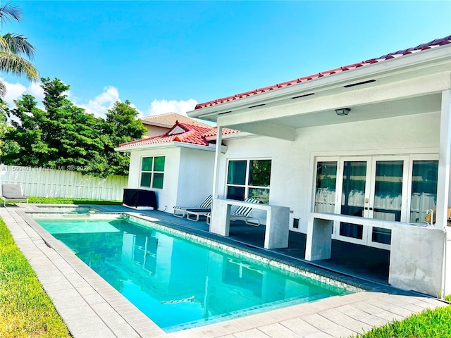 view of swimming pool featuring a patio